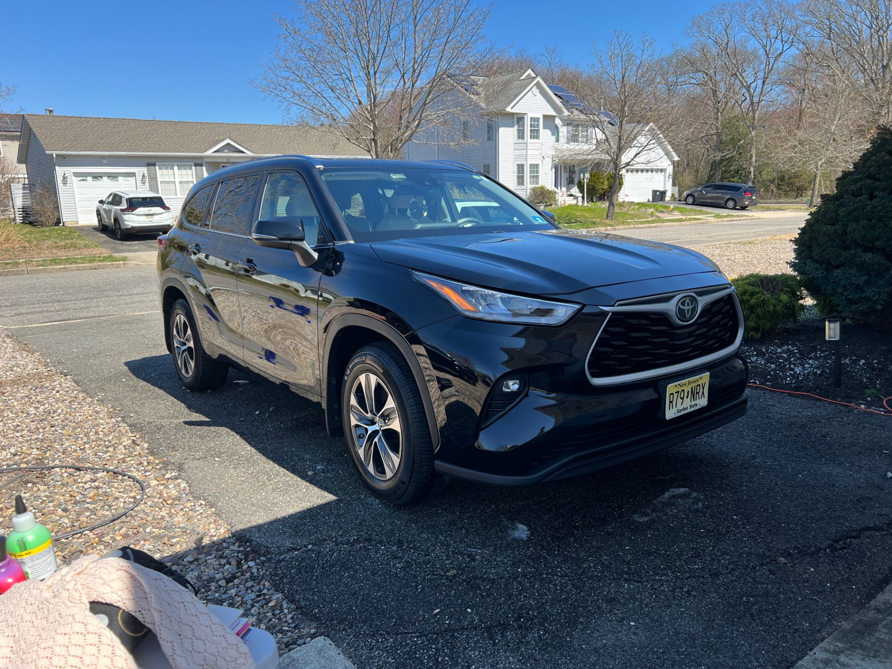 Black Toyota Highlander with mirror-finish paint after detail